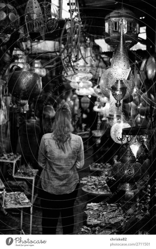 Woman in a lamp shop Shopping Style Design Joy Money Save Tourism Sightseeing City trip Interior design Decoration Lamp Feminine Adults 1 Human being Town