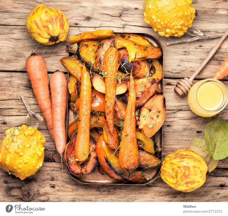 Baked pumpkin with carrots and quince vegetable healthy vegetarian food bake orange slice autumn garnish rustic roasted thyme tray dieting fried spicy yellow