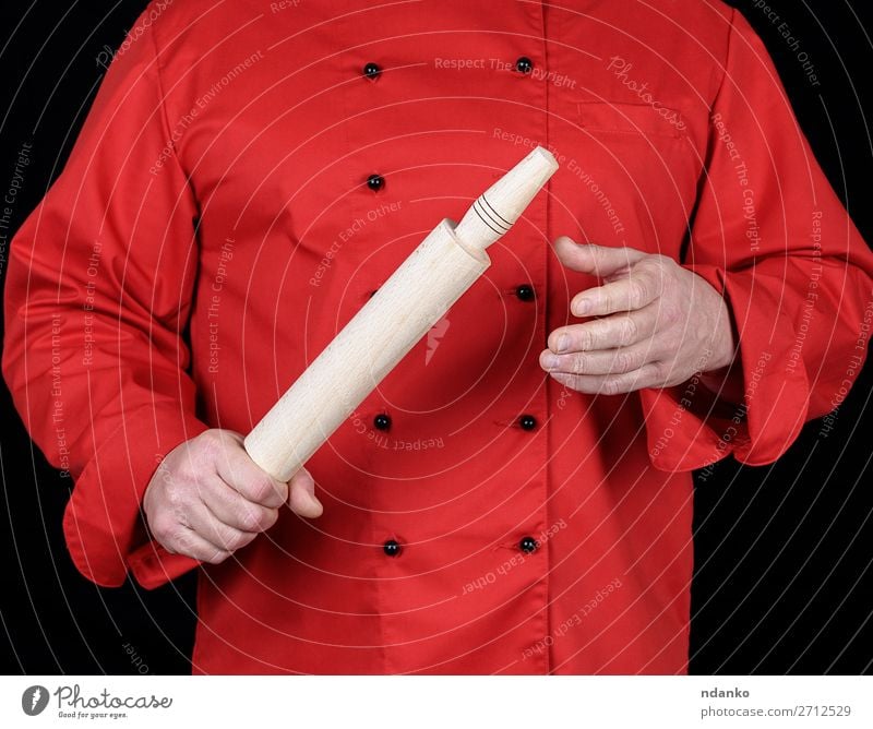 cook in a red uniform holding a wooden rolling pin Kitchen Restaurant Work and employment Profession Cook Human being Man Adults Hand Clothing Shirt Suit Jacket