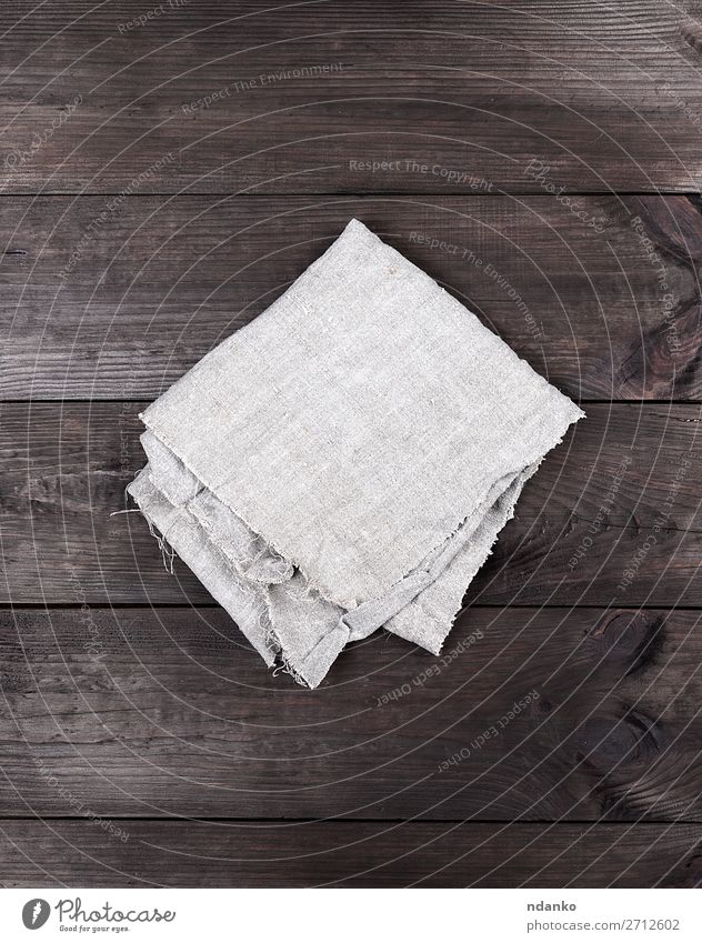 https://www.photocase.com/photos/2712602-folded-gray-towel-on-brown-wooden-background-photocase-stock-photo-large.jpeg