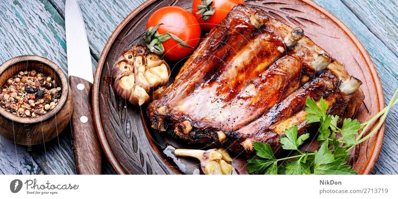 Tasty roasted ribs meat food bbq grilled barbecue pork dinner wooden pork rib cuisine rustic board spicy marinated american fat delicious bone smoked dark baked