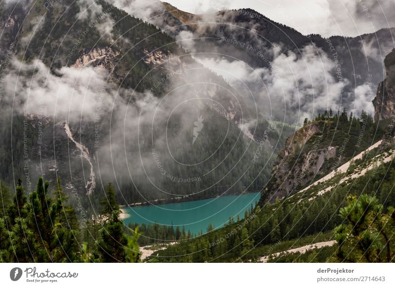 Braies Lake with clouds in the Dolomites XVII Tourism Structures and shapes Copy Space bottom Vacation & Travel Light Copy Space right Shadow Contrast