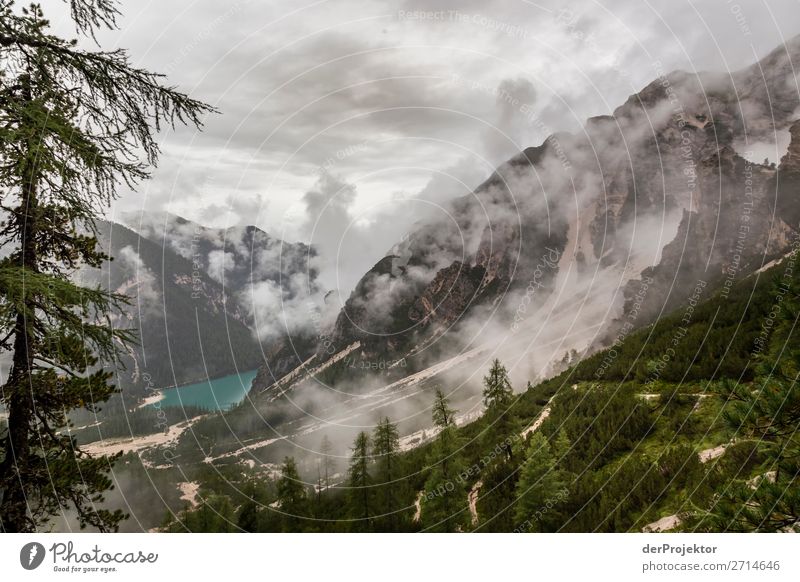 Braies Lake with clouds in the Dolomites XII Tourism Structures and shapes Copy Space bottom Vacation & Travel Light Copy Space right Shadow Contrast