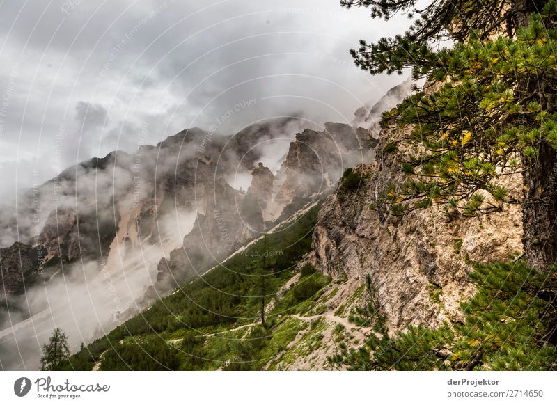 Above Braies Lake with clouds in the Dolomites I Tourism Structures and shapes Copy Space bottom Vacation & Travel Light Copy Space right Shadow Contrast