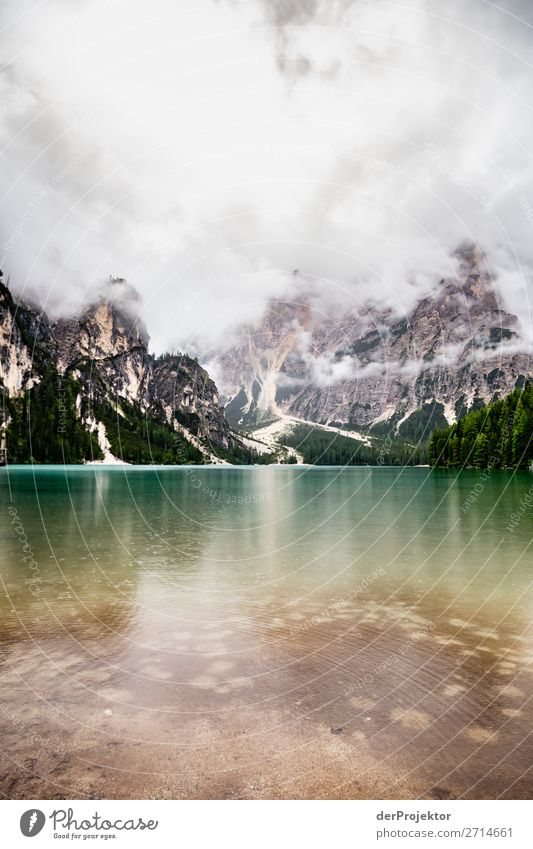 Braies Lake with clouds in the Dolomites VII Tourism Structures and shapes Copy Space bottom Vacation & Travel Light Copy Space right Shadow Contrast