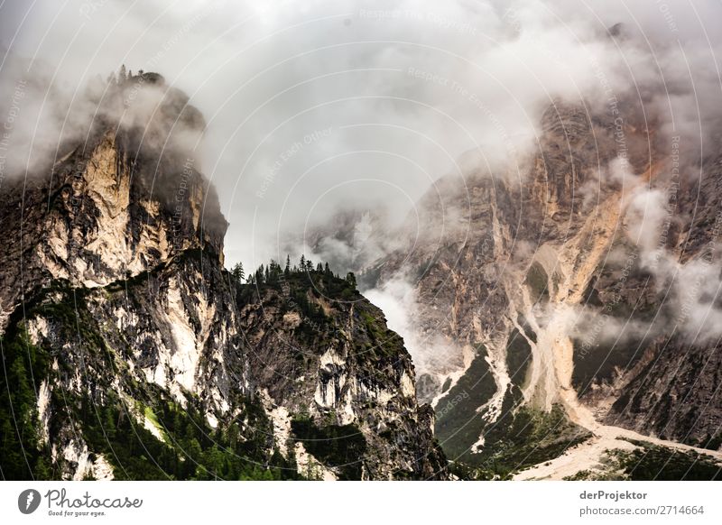 Above Braies Lake with clouds in the Dolomites V Tourism Structures and shapes Copy Space bottom Vacation & Travel Light Copy Space right Shadow Contrast