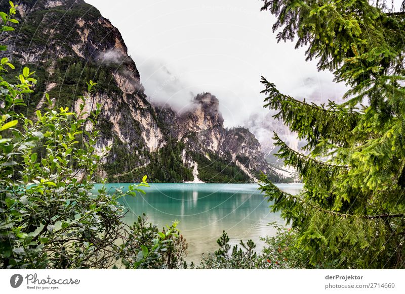 Braies Lake with clouds in the Dolomites V Tourism Structures and shapes Copy Space bottom Vacation & Travel Light Copy Space right Shadow Contrast