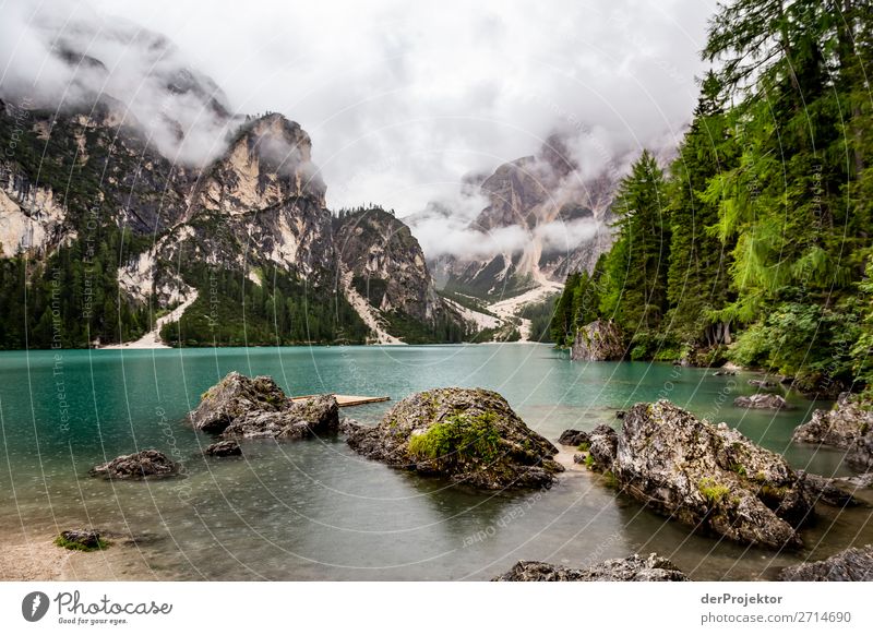 Braies Lake with clouds in the Dolomites X Tourism Structures and shapes Copy Space bottom Vacation & Travel Light Copy Space right Shadow Contrast