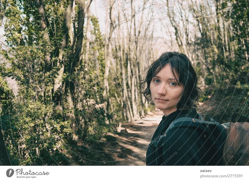 Portrait of a blue-eyed hiker looking at camera in the forest Beautiful Face Vacation & Travel Adventure Hiking Human being Woman Adults Environment Nature