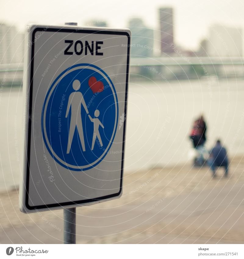family zone Town Populated Places Pedestrian Road sign Emotions Humanity Watchfulness Tolerant Far-off places Rotterdam Colour photo Exterior shot Day