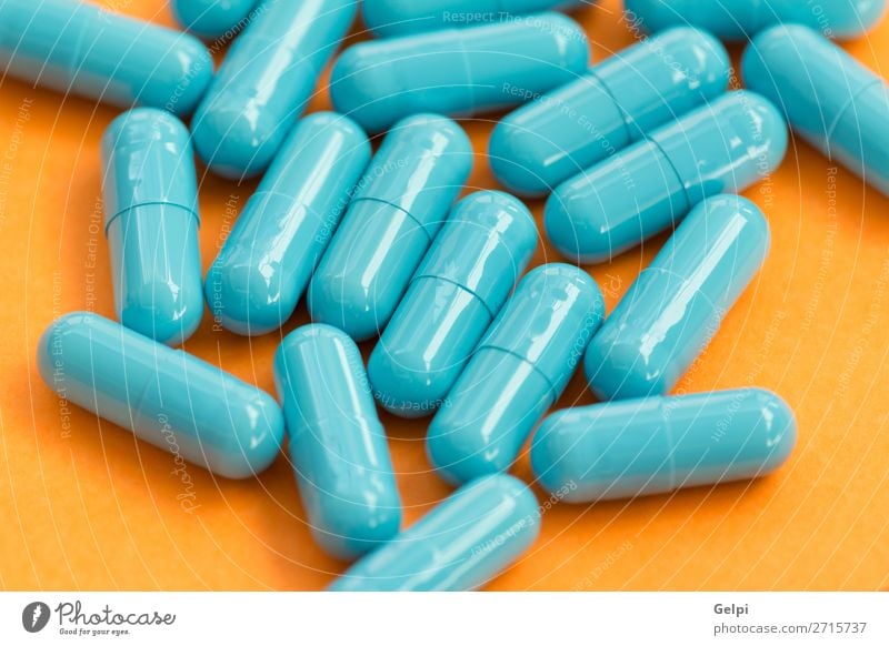 Blue pills on orange background Bottle Health care Medical treatment Illness Medication Science & Research Hospital White Pain Pharmacy medicine health healthy
