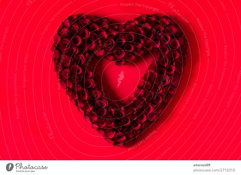 Heart made of red roses on red background for Valentine's Day. Love Mother's Day Rose Flower Symbols and metaphors Feasts & Celebrations Vacation & Travel