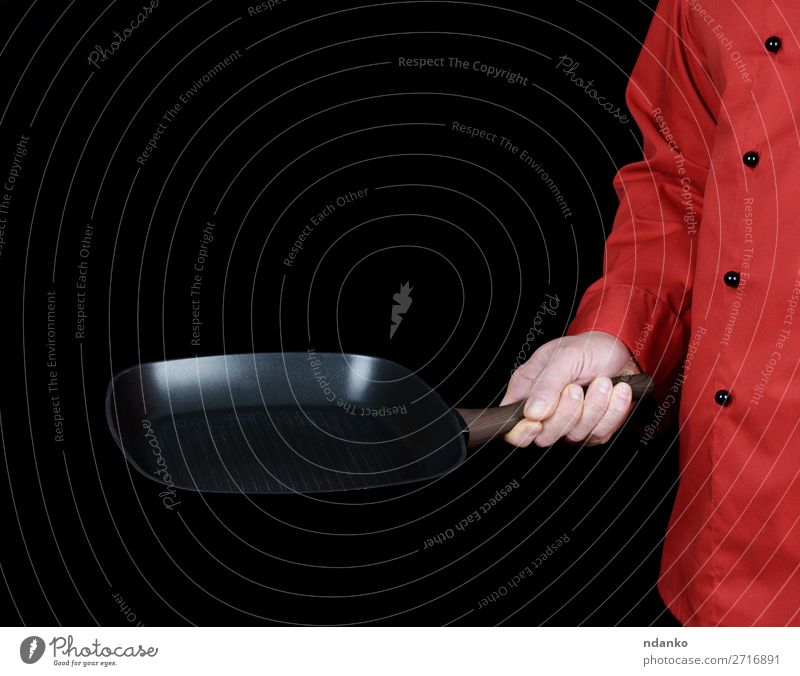 cook in red uniform holding a frying pan Pan Kitchen Restaurant Cook Human being Man Adults Hand Clothing Red Black Cast iron Caucasian chef cooking Domestic