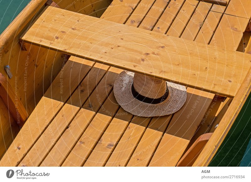 Straw hat in rowing boat Lifestyle Joy Relaxation Leisure and hobbies Rowing Vacation & Travel Trip Summer Sunbathing Warmth Lake Rowboat To enjoy Hot Bright