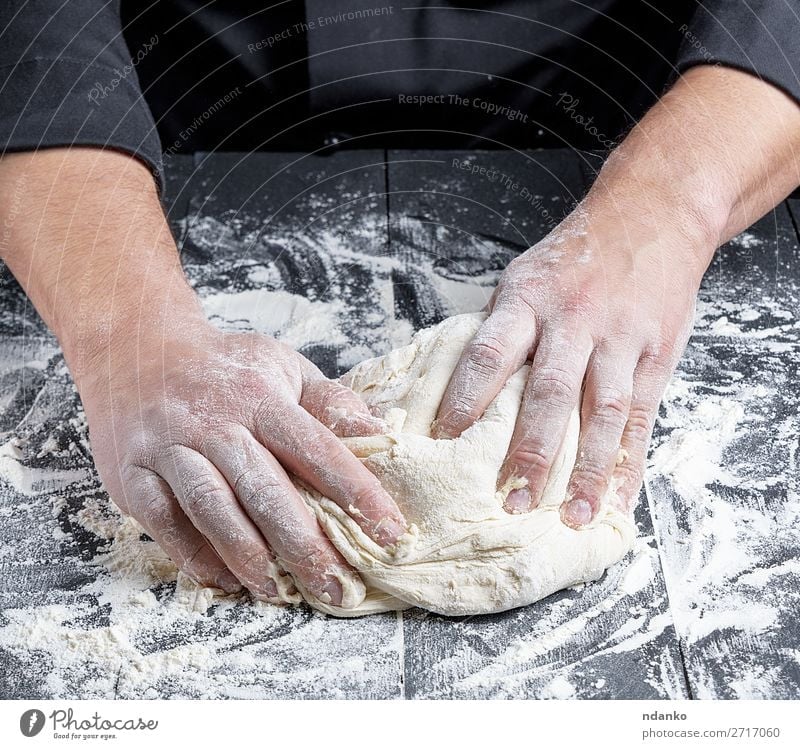 baker kneads white wheat flour dough Dough Baked goods Bread Nutrition Table Kitchen Profession Cook Man Adults Hand Wood Make Fresh Black White Tradition