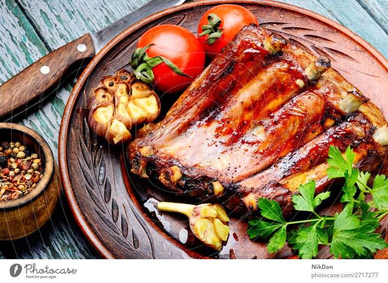 Tasty roasted ribs meat food bbq grilled barbecue pork dinner wooden pork rib cuisine rustic board spicy marinated american fat delicious bone smoked dark baked
