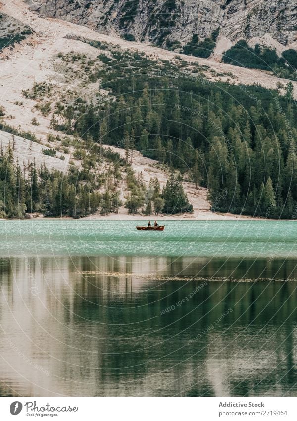 People in boat floating in lake Human being Watercraft Lake Mountain Adventure Trip Exterior shot Relaxation Panorama (Format) Landscape scenery Serene Peaceful
