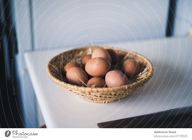Straw bowl with chicken eggs Egg Bowl Chicken whole Basket Food Ingredients Cooking Raw Fresh Protein Natural Organic Brown Breakfast Easter Eggshell Healthy