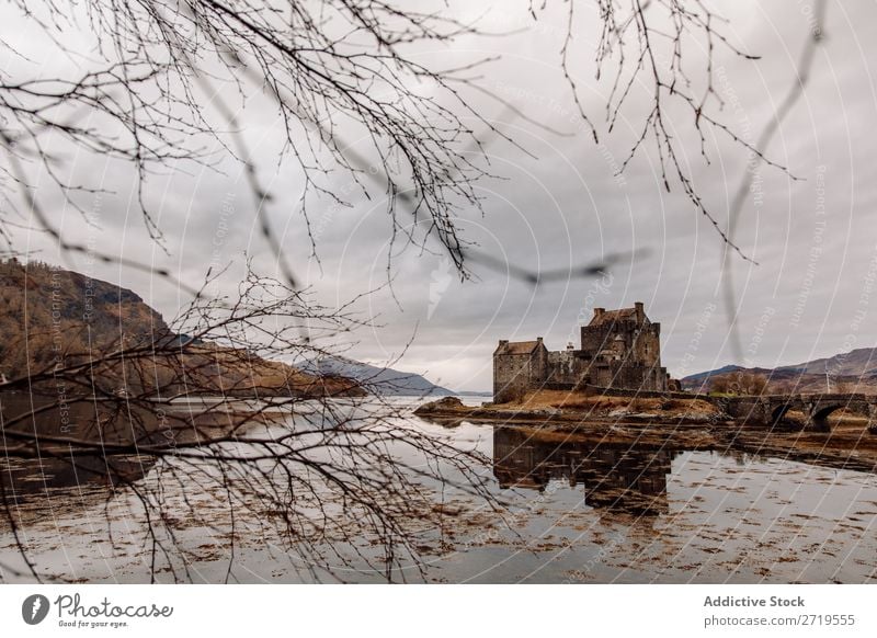 Historic castle at lake Castle Old Coast Rock Lake Hill Mountain Landscape Nature Water Natural mansion big Stone Beautiful Clouds Scotland Grass