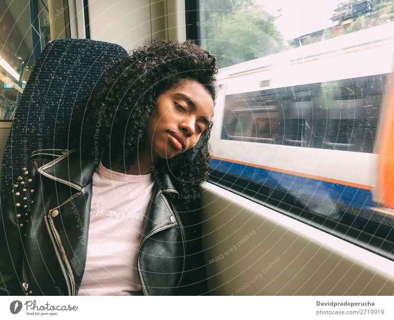 Tired black woman sleeping on the train Woman Transport Commute asleep Fatigue Railroad Window Far-off places sleepy Sleep Black Dream Lean wagon Lifestyle Trip