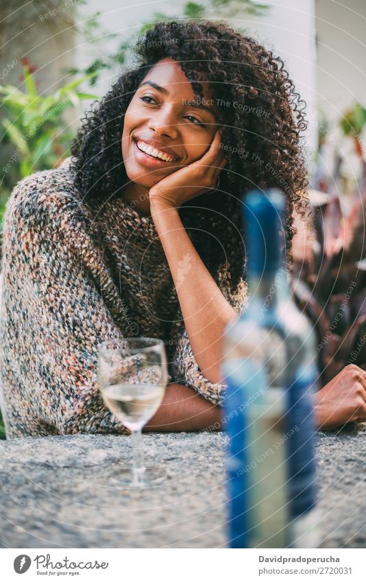 Woman in a countryside house garden drinking wine Ethnic 1 black woman Home Attractive Adults Rural Beautiful Glass Wine Winter Curly Portrait photograph pretty