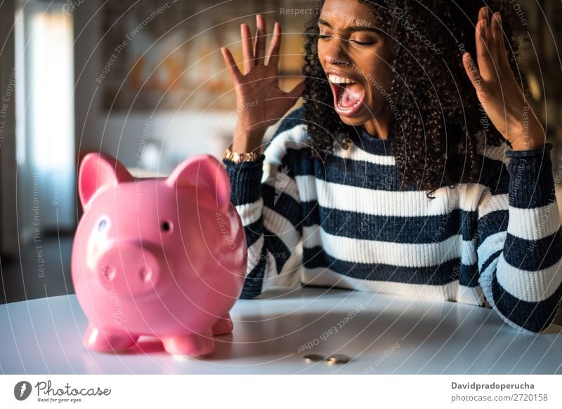 Black unhappy woman angry at piggy bank Woman Money box savings Crisis Sadness Anger Stress Emotions annoyed Scream trouble Expression frustrated Problem