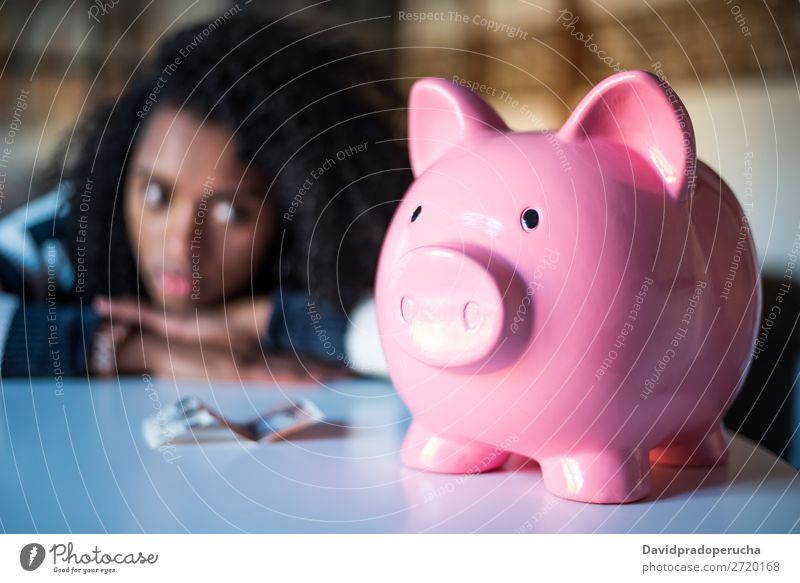 Sad frustrated black woman with piggy bank Woman Money box debt Crisis Sadness Budget Anger worried Financial Industry annoyed Stress Considerate Problem