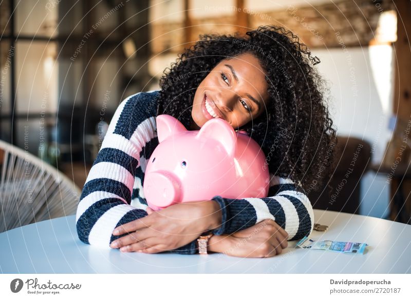 Black woman hugging her piggy bank Woman Money box savings Success Business cash Coin Euro Beautiful Happy Cheerful investment wealth Budget Financial Industry