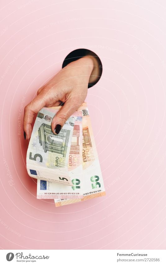 A woman's hand holding banknotes Feminine 1 Human being Money Pink 50 10 Euro Euro bill Financial Industry Hollow Circle Hand Low-cut Fingers Donation