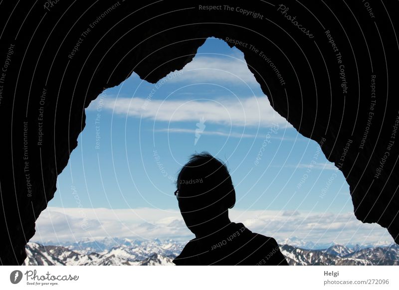 Silhouette of a man's head between rocks with a view of the Alps Vacation & Travel Tourism Trip Summer Mountain Hiking Human being Masculine Man Adults