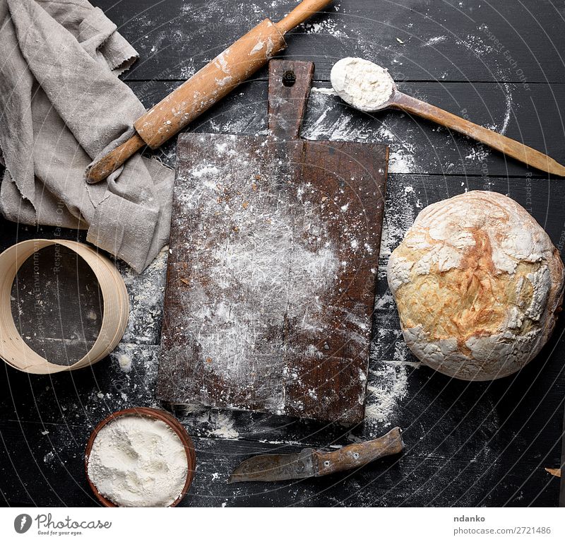baked bread, white wheat flour Bread Bowl Knives Spoon Table Kitchen Sieve Wood Make Dark Fresh Above Brown Black White Tradition Culinary Baking Bakery board
