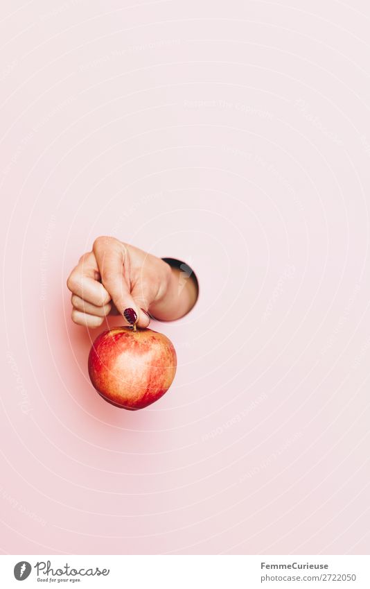 Hand of a woman holding an apple Life Feminine Woman Adults 1 Human being Healthy Apple Vitamin Healthy Eating Vegetarian diet Vegan diet Pink To hold on