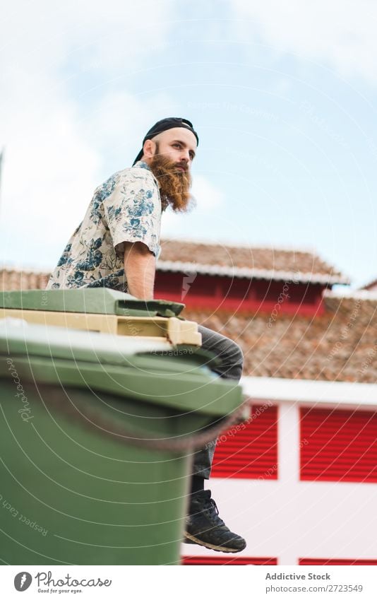 Bearded man sitting on dumpster Man City Street Sit bearded Trash container Container Lifestyle Youth (Young adults) Town Human being Guy Cool (slang) Style