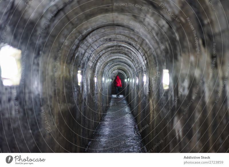 Person walking on illuminated tunnel Man Tunnel Walking Illuminate Light Dark Conceptual design Loneliness Underground Corridor Human being Azores Way out