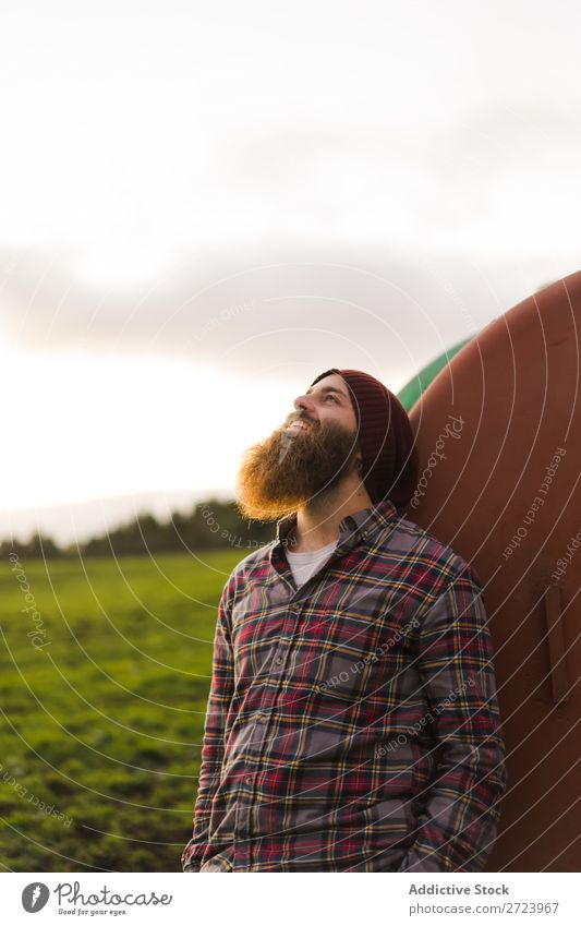 Thoughtful man leaning on barrel Tourist Field Green Landscape Nature Sky Summer bearded Lean Keg Rust Old Considerate Vacation & Travel Tourism Rural