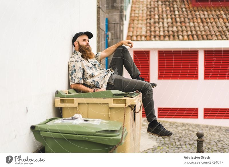 Bearded man sitting on dumpster Man City Street Sit bearded Trash container Container Lifestyle Youth (Young adults) Town Human being Guy Cool (slang) Style