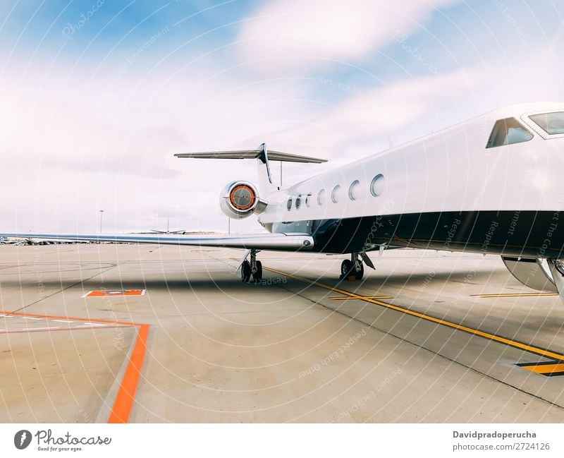 Private luxury jet at the airport terminal aerospace Air Aircraft Airfield Aviation Passenger plane Airplane Airport airstrip Business business class Clouds