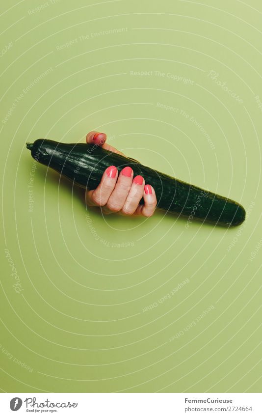 Hand of a woman holding a cucumber Feminine 1 Human being Esthetic Food Nutrition Healthy Eating Phallic symbol Penis Fertile Vegetable Cucumber Force Fingers