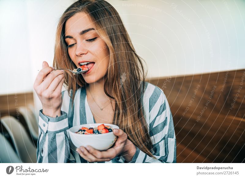 woman close up eating oat and fruits bowl for breakfast Beautiful Blueberry Bowl Breakfast Cereal Close-up Crops Dairy Delicious Dessert Diet To feed Eating
