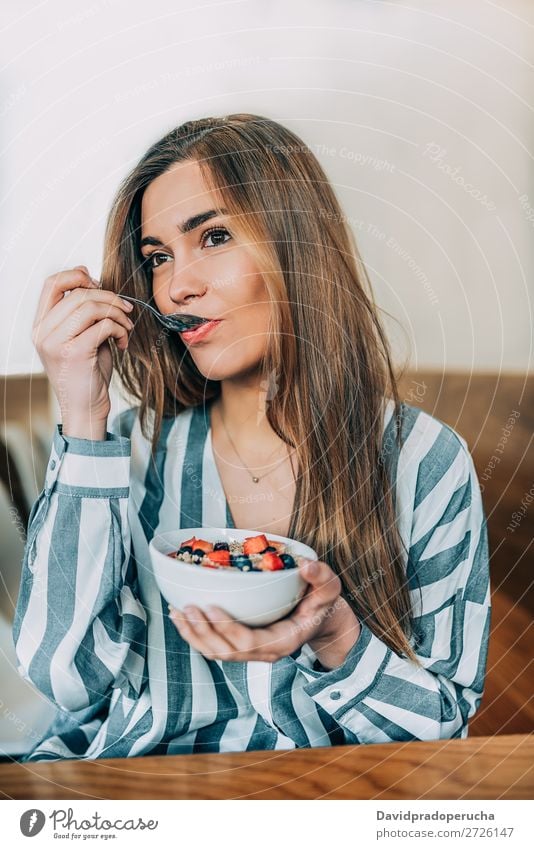 woman close up eating oat and fruits bowl for breakfast Bowl Breakfast Woman Cereal porridge Hand Crops Strawberry Blueberry Oats Healthy Food White Organic
