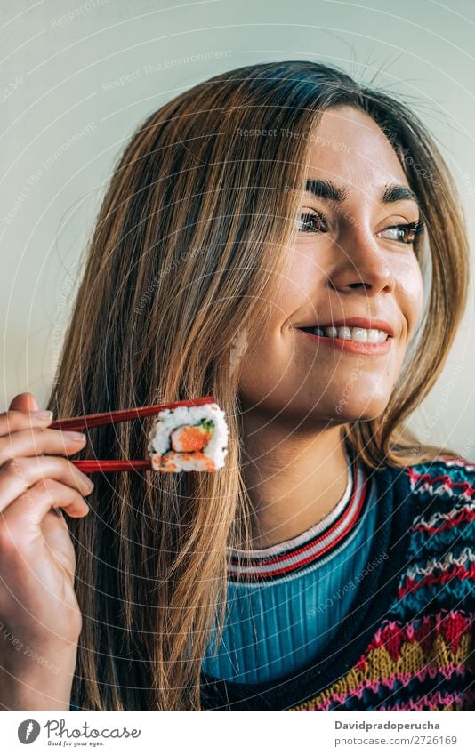 Woman eating sushi Japanese Attractive Beautiful Beauty Photography Blonde california roll Caucasian Chopstick Close-up Delicious Diet Dinner To feed Eating
