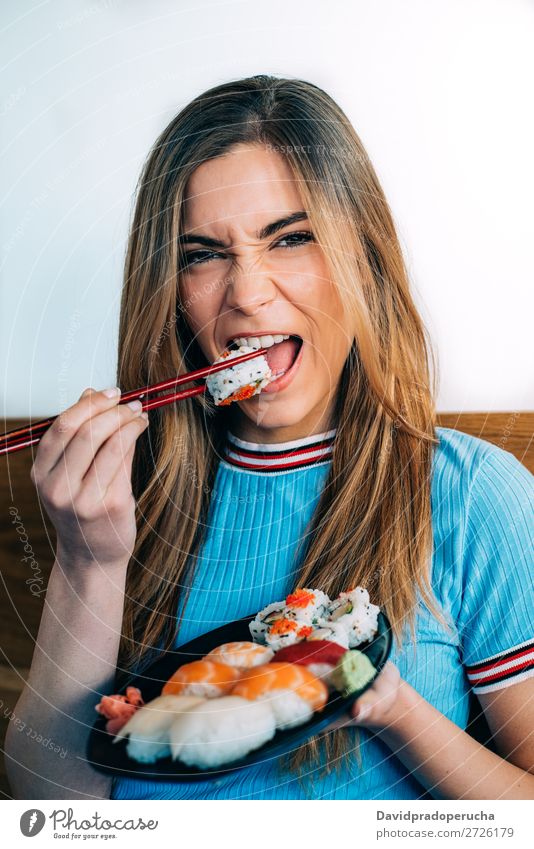 Crop woman eating sushi Japanese Anonymous Attractive Beautiful Beauty Photography Blonde california roll Caucasian Chopstick Close-up Crops Delicious Diet