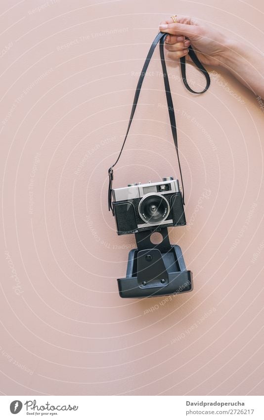 Hand holding a Vintage camera isolated at pink wall Arm Camera Pink Wall (building) Retro Old Isolated Studio shot Hold Leisure and hobbies Illustration Blank