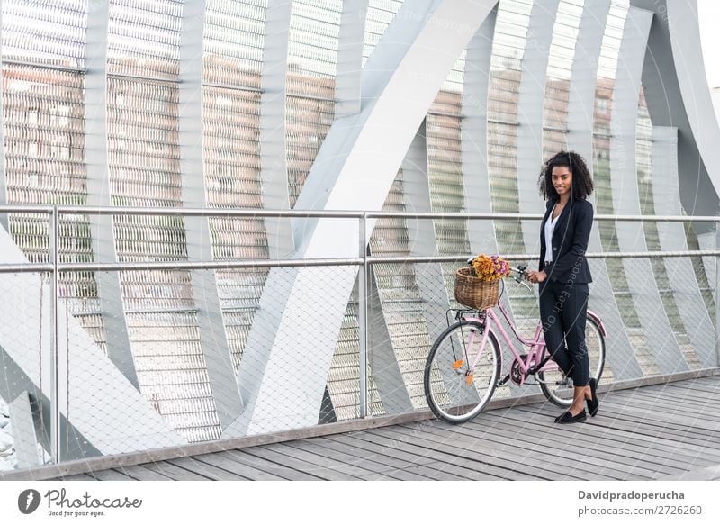 Business black woman with vintage bicycle in a bridge Bicycle Cycling Vintage Woman Black Bridge Mixed race ethnicity City Youth (Young adults) Human being Suit