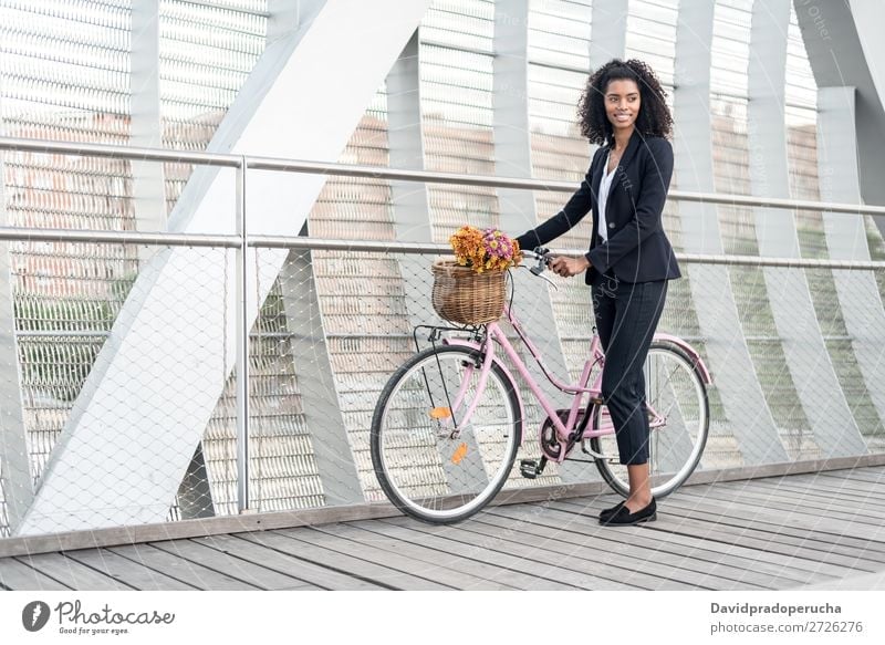 Business black woman with vintage bicycle in a bridge Woman Bicycle Cycling Vintage Black Bridge Mixed race ethnicity City Youth (Young adults) Human being Suit