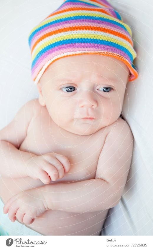 Baby with a colourful headscarf and blue eyes Lifestyle Joy Happy Beautiful Skin Face Child Human being Toddler Boy (child) Infancy Mouth Warmth Headscarf Sleep