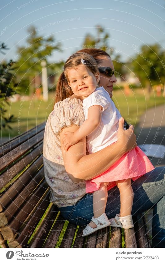 Baby girl standing on a bench hugging to woman Lifestyle Joy Beautiful Leisure and hobbies Summer Garden Child Human being Toddler Woman Adults Mother