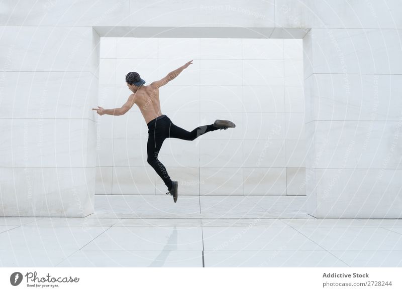 Shirtless man in jump Man Jump Studio shot Sports Modern Action Breakdance Dancer Freedom Entertainment Expression Youth (Young adults) Model Posture Energy