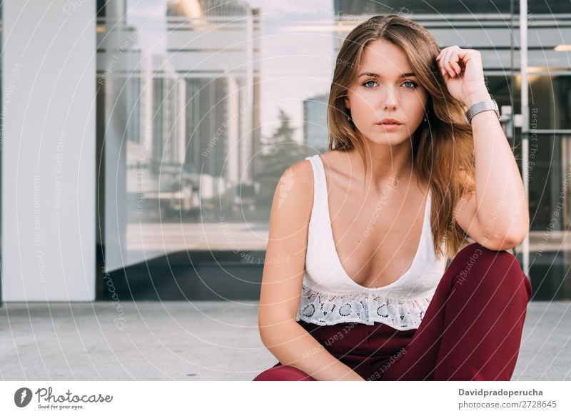 Beautiful young woman sitting in the stairs posing Woman Blonde Sit Stairs Exterior shot sits Youth (Young adults) Steps Beauty Photography City Town
