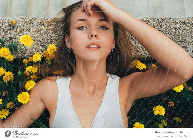 Young woman lying down on flowers Human being Feminine Youth (Young adults) Woman Adults Body Skin Face Eyes Nose Mouth Lips 1 18 - 30 years Self-confident Day